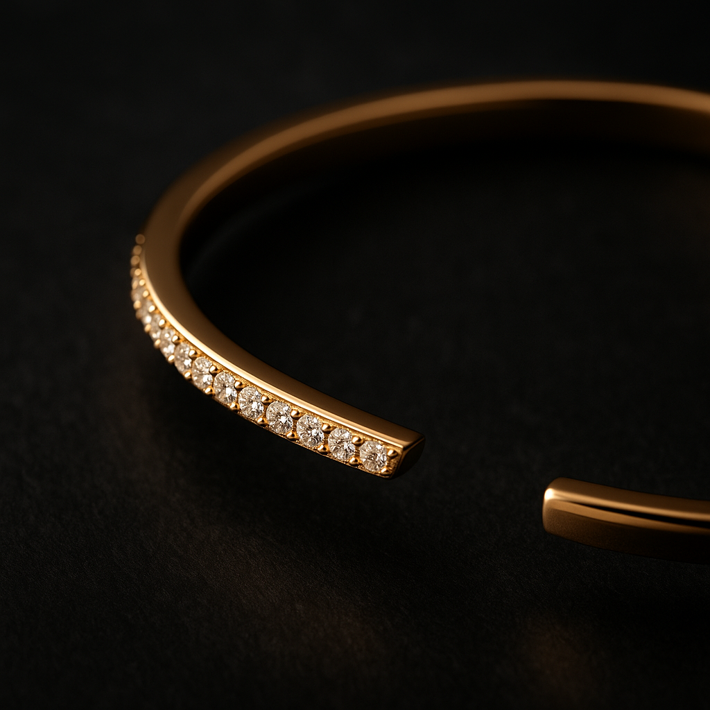 Gold bracelet with embedded diamonds on a black background