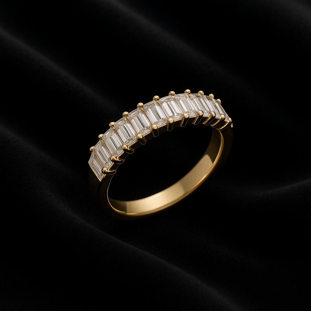 Gold ring with baguette-cut diamonds on a black background